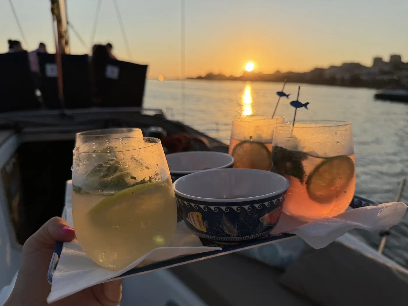 Golden-hour sunset over the Douro from a Port Sailors sailboat off Porto