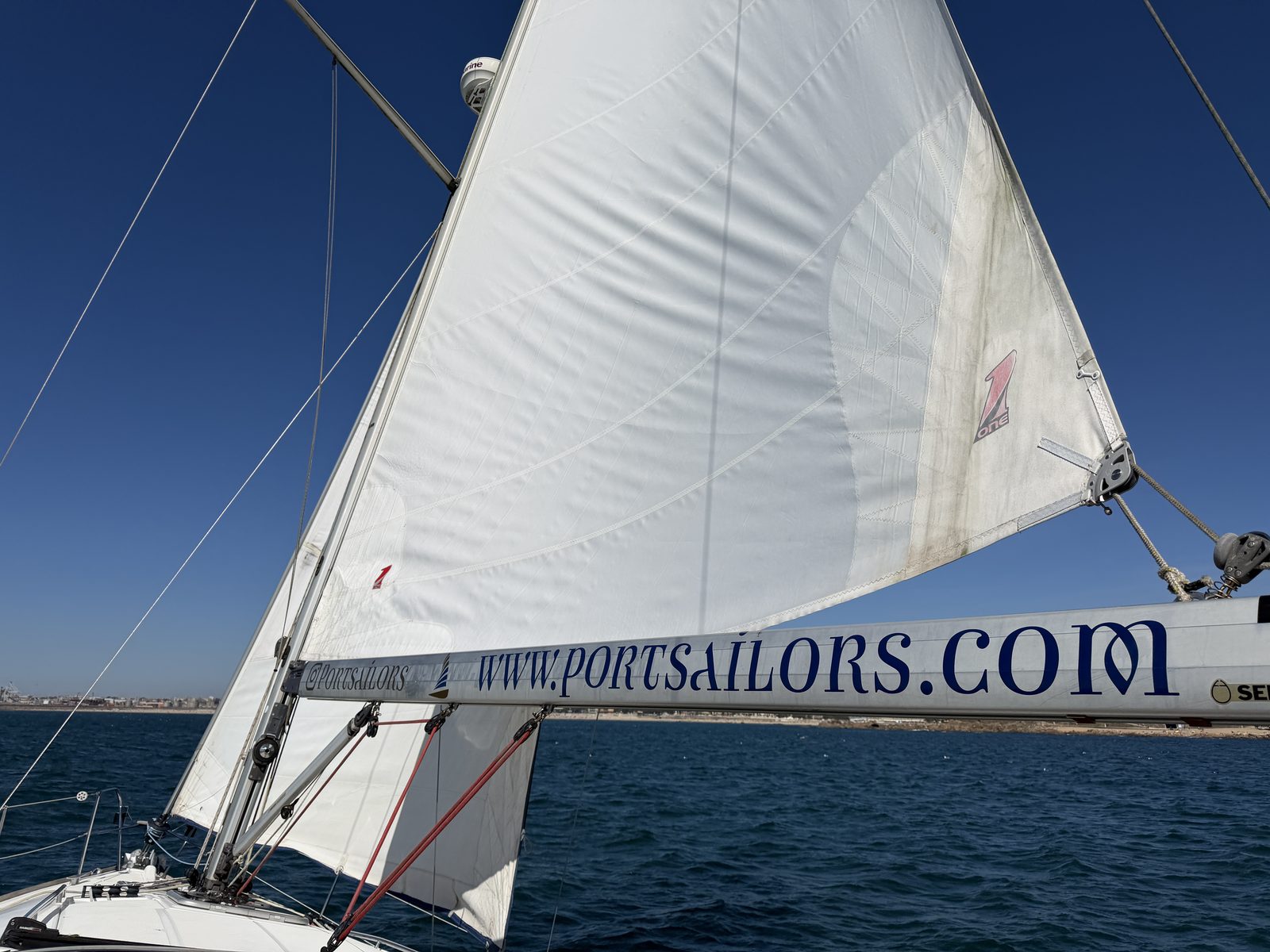 Port Sailors sailboat under full sail on the Atlantic off Porto in autumn